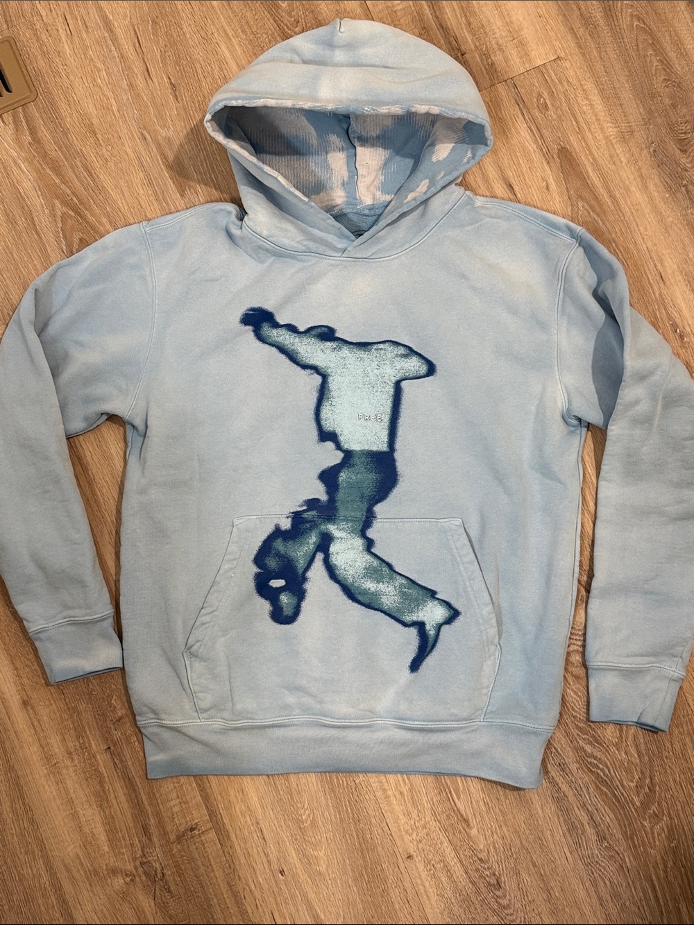 Kid Cudi Light Blue Graphic Hoodie with Dark Blue Figure